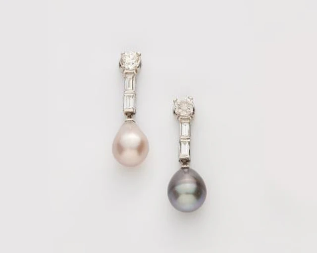 A pair of platinum diamond and Oriental coloured pearl drop earrings.
