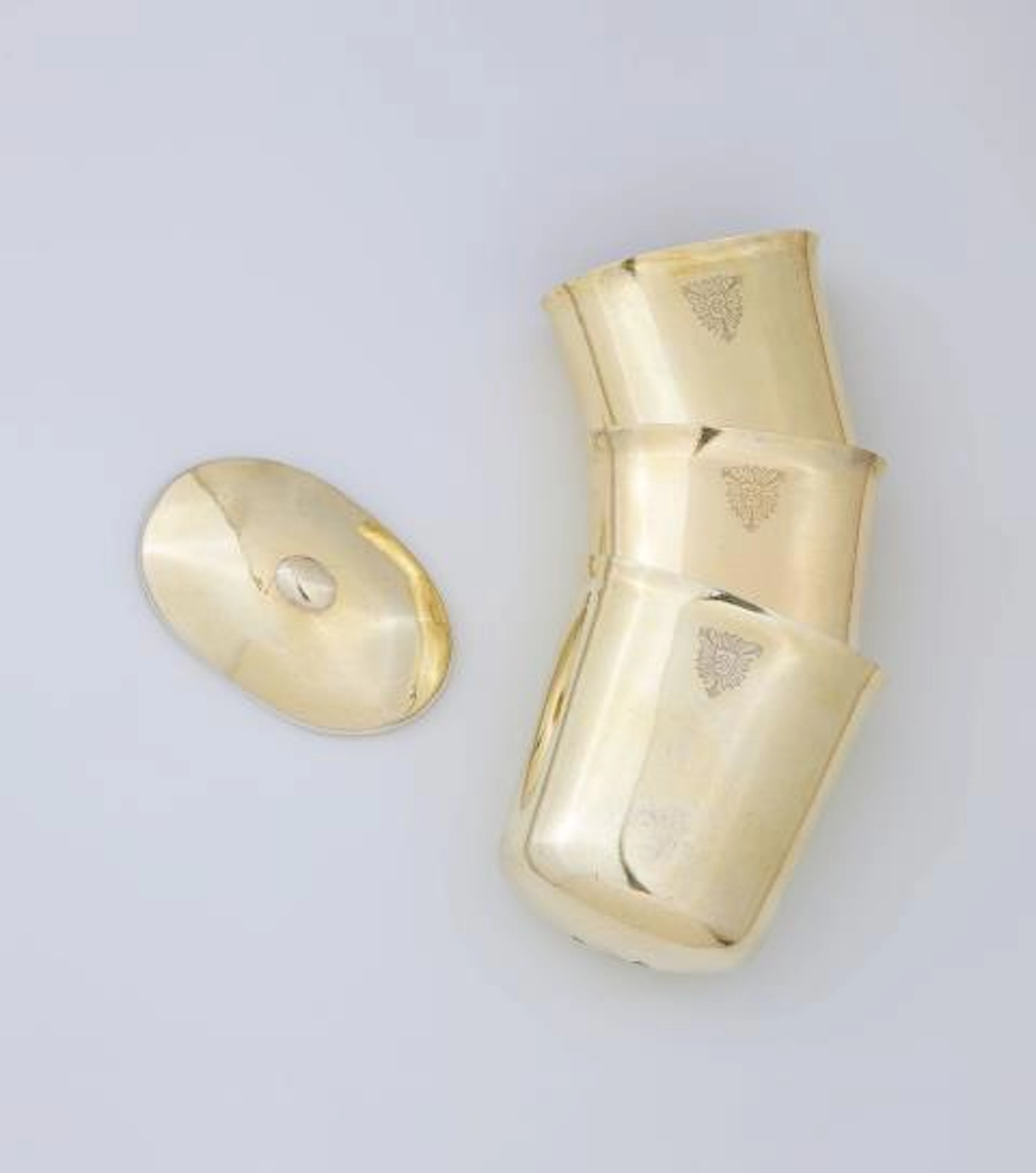 A set of three Augsburg silver gilt 'sturzbecher' cups with cover