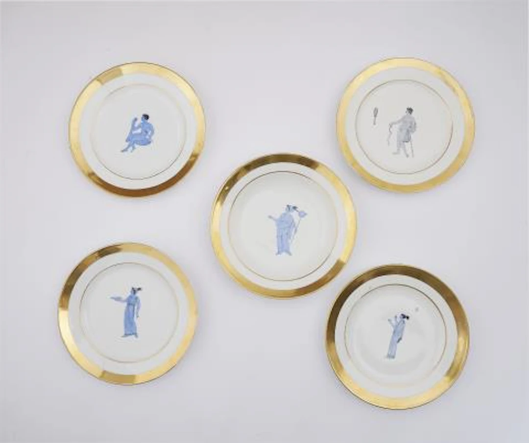 Four Parisian porcelain dinner plates and one soup bowl