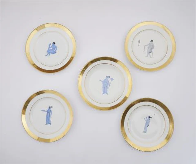 Four Parisian porcelain dinner plates and one soup bowl