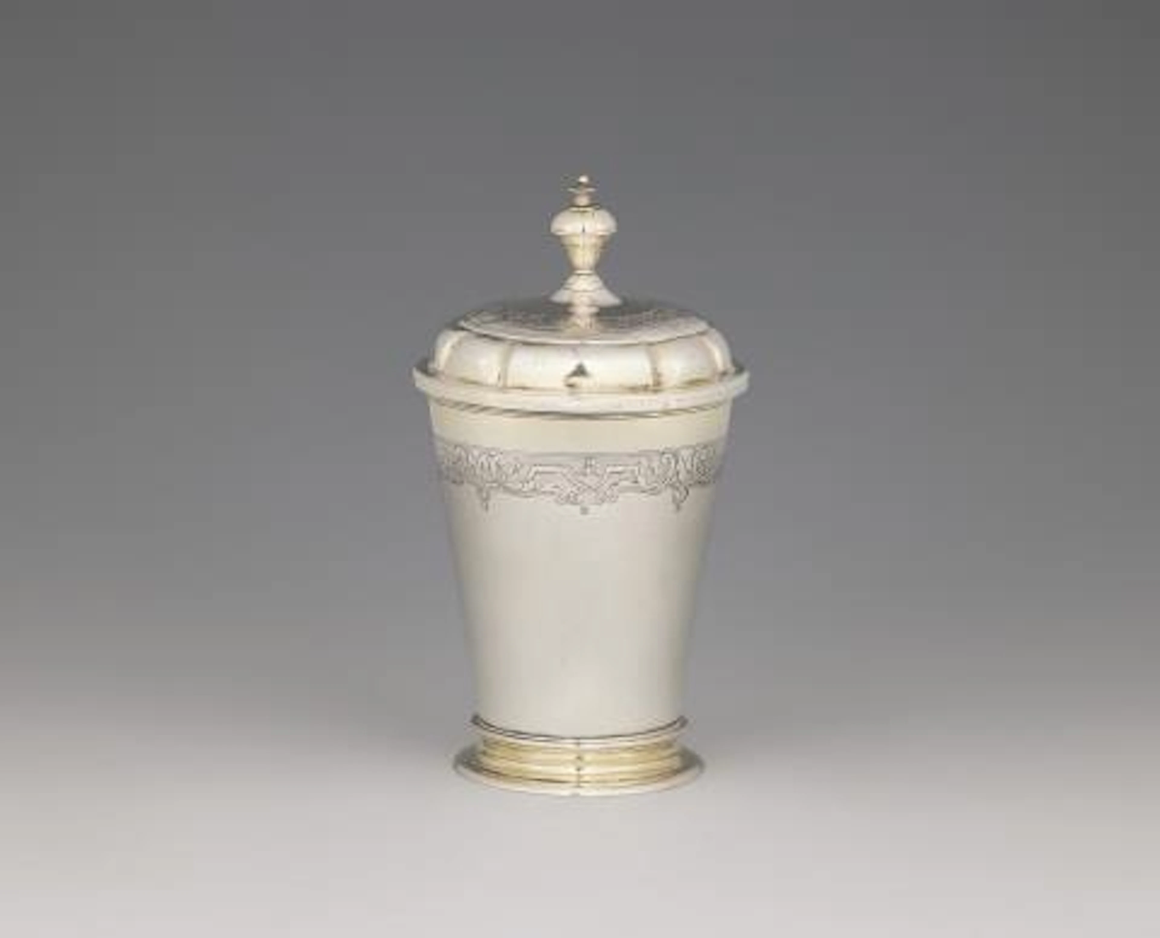 A parcel-gilt Dresden silver beaker and cover