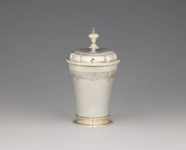 A parcel-gilt Dresden silver beaker and cover