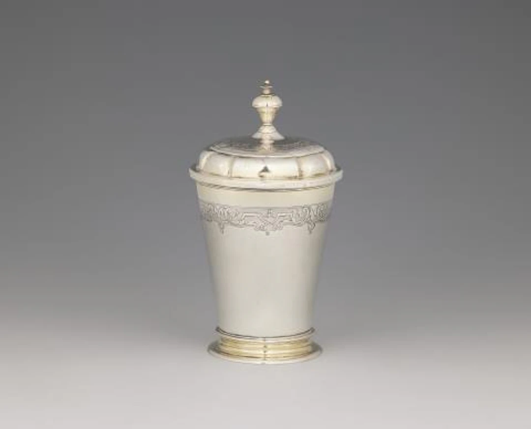 A parcel-gilt Dresden silver beaker and cover