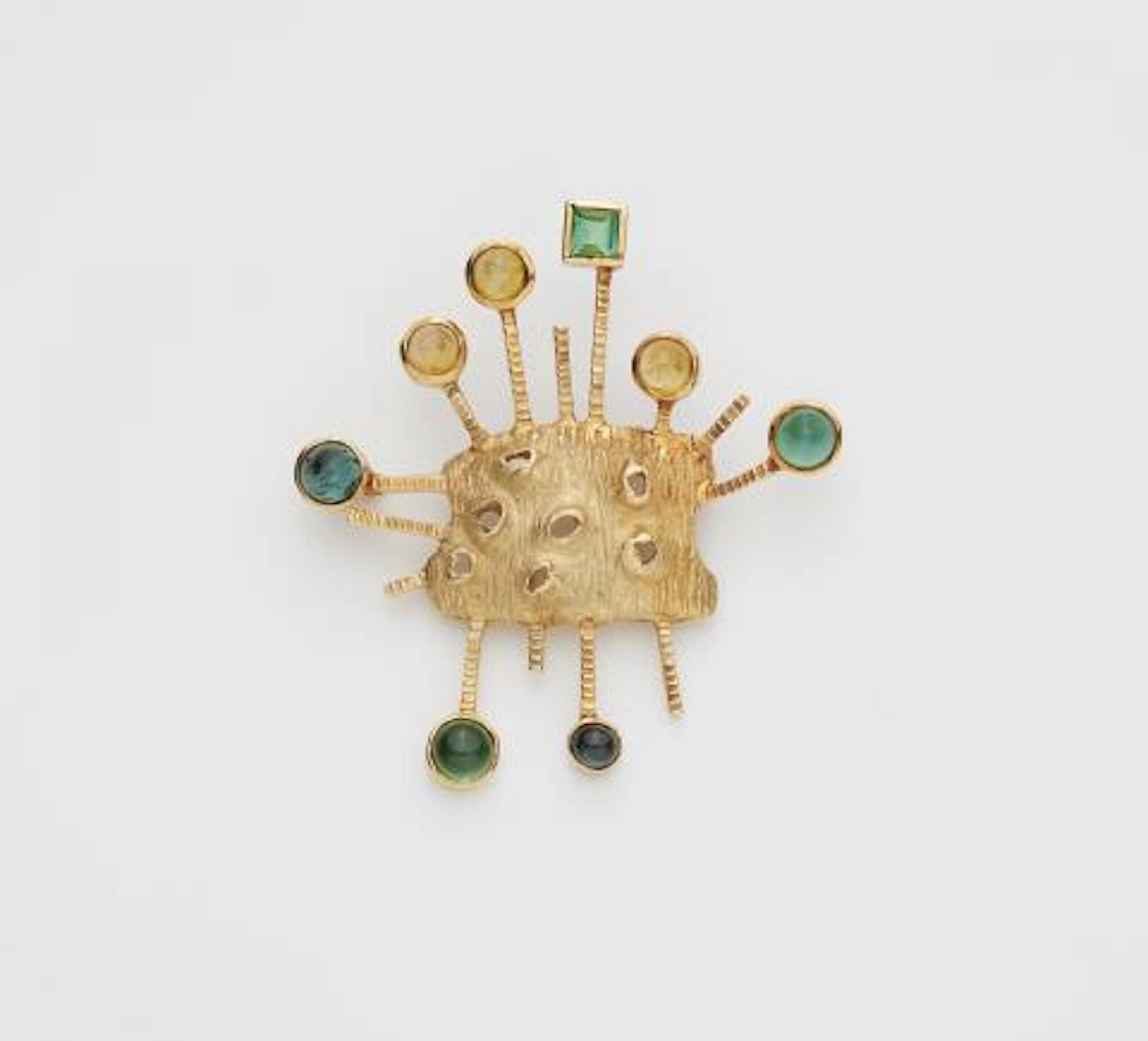 An abstract textured 14k gold tourmaline and citrine brooch.