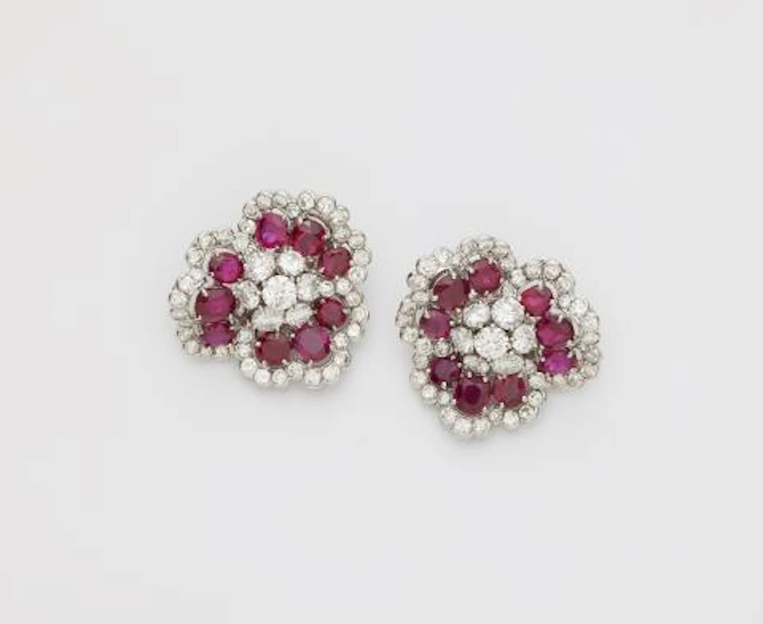 A pair of French 18k gold platinum diamond and ruby "Camellia" clip earrings.