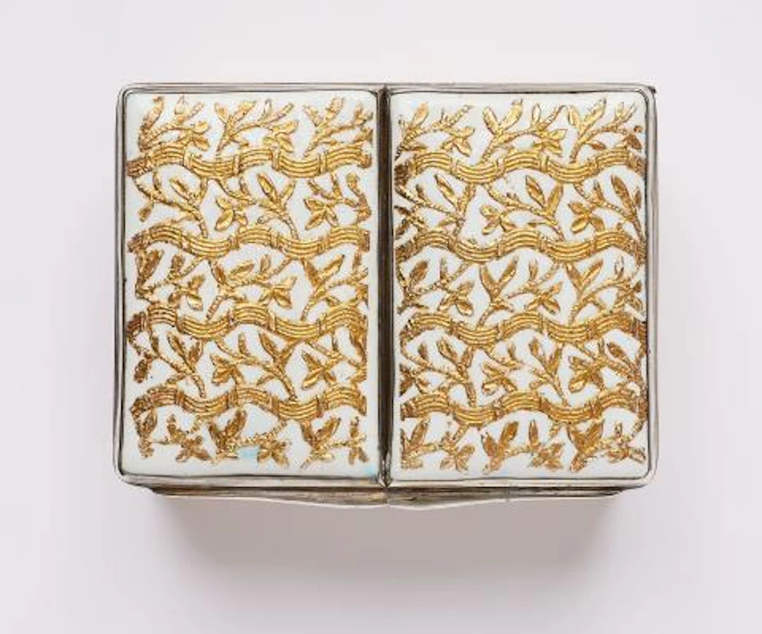 An enamelled double-box with gold tendril ornament