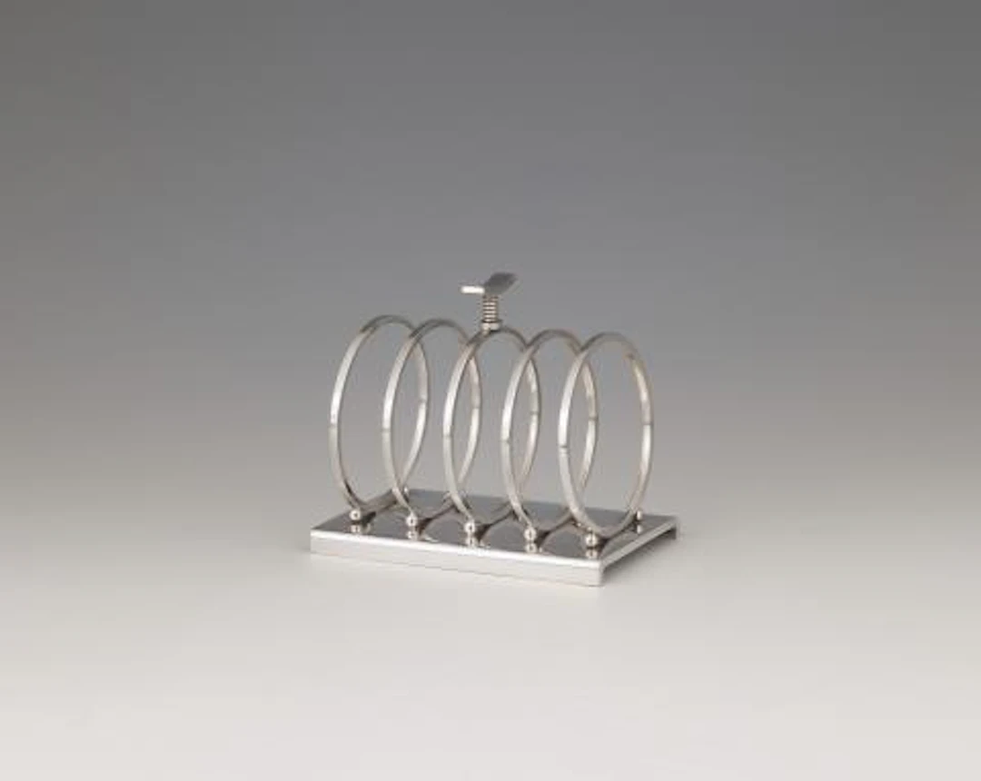 A rare Georg Jensen silver toast stand no. 824 designed by Sigvard Bernadotte