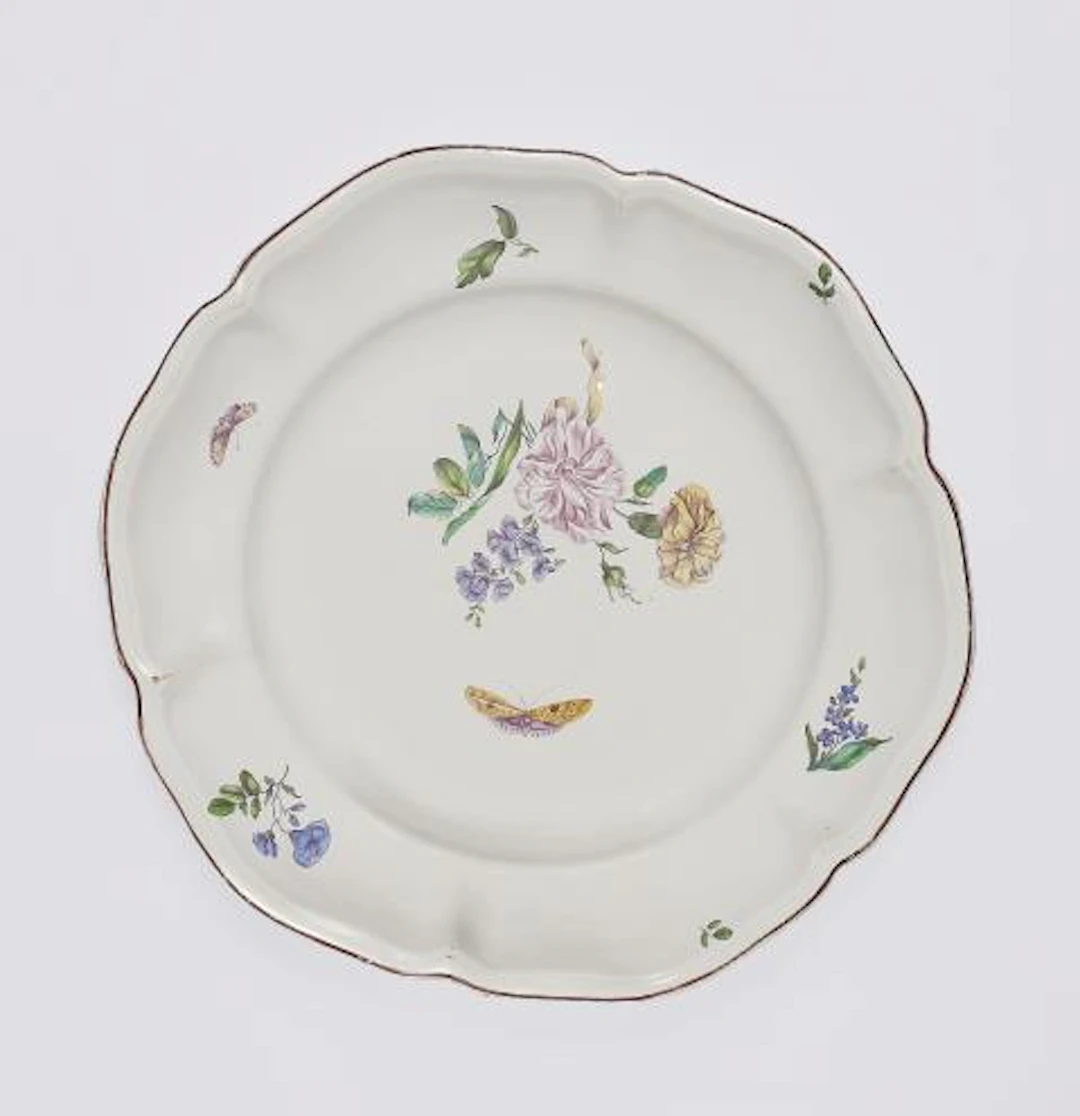 A large Strasbourg faience plate with finely painted flowers