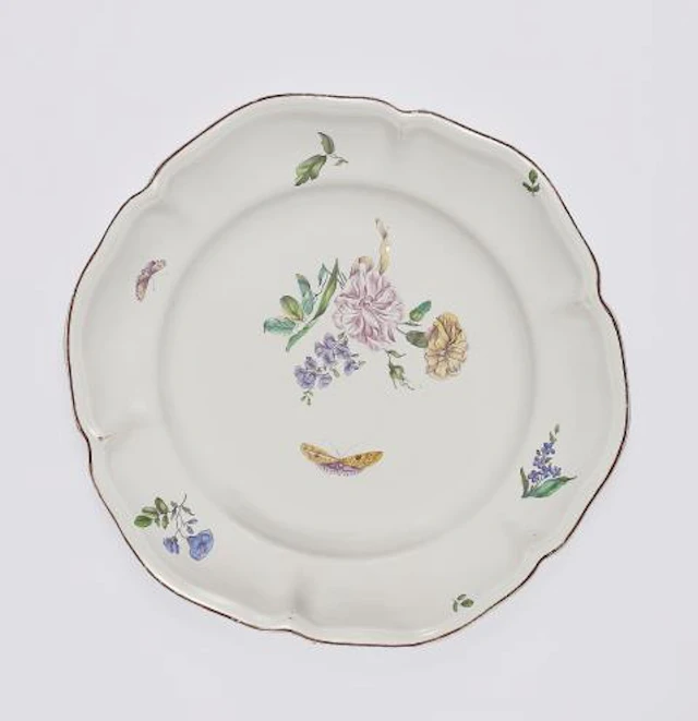 A large Strasbourg faience plate with finely painted flowers