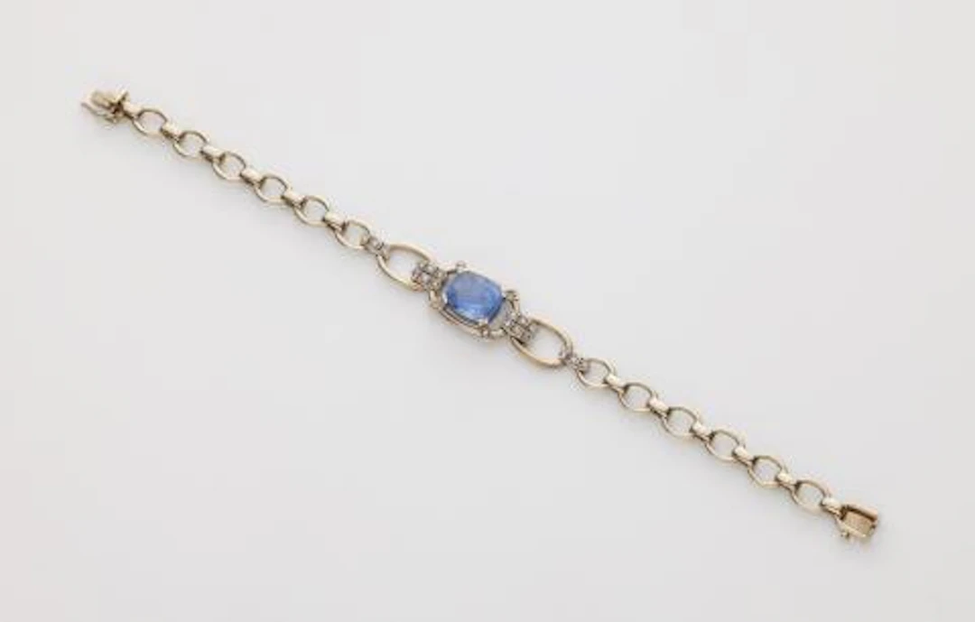 A German 18k white gold diamond and Ceylon sapphire chain bracelet.