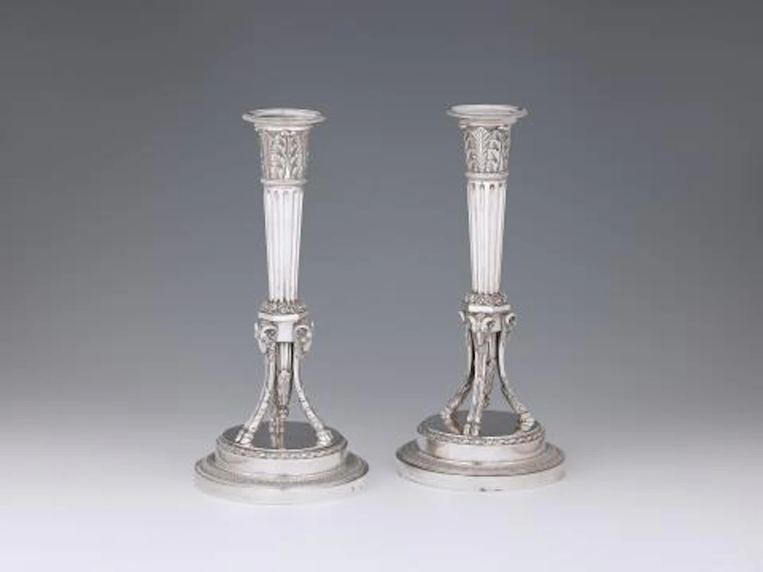 A pair of Parisian Empire silver candlesticks