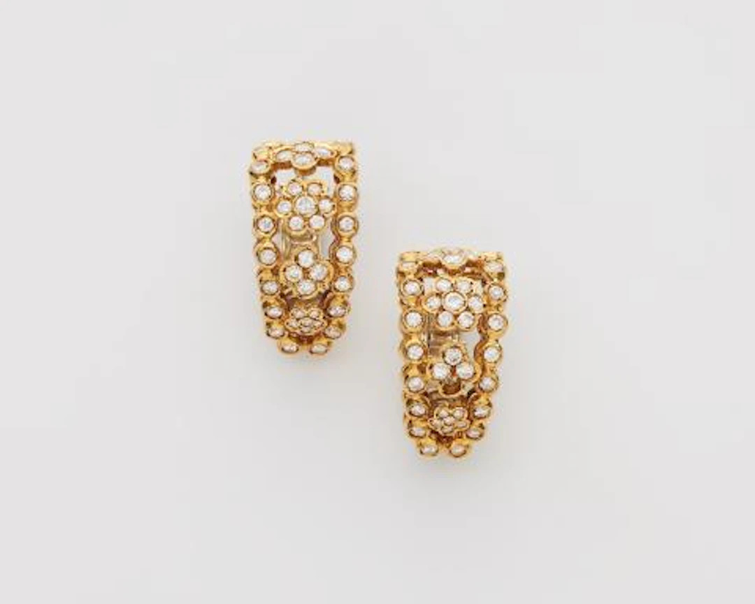 A pair of Italian 18k yellow gold and diamond creole clip earrings.