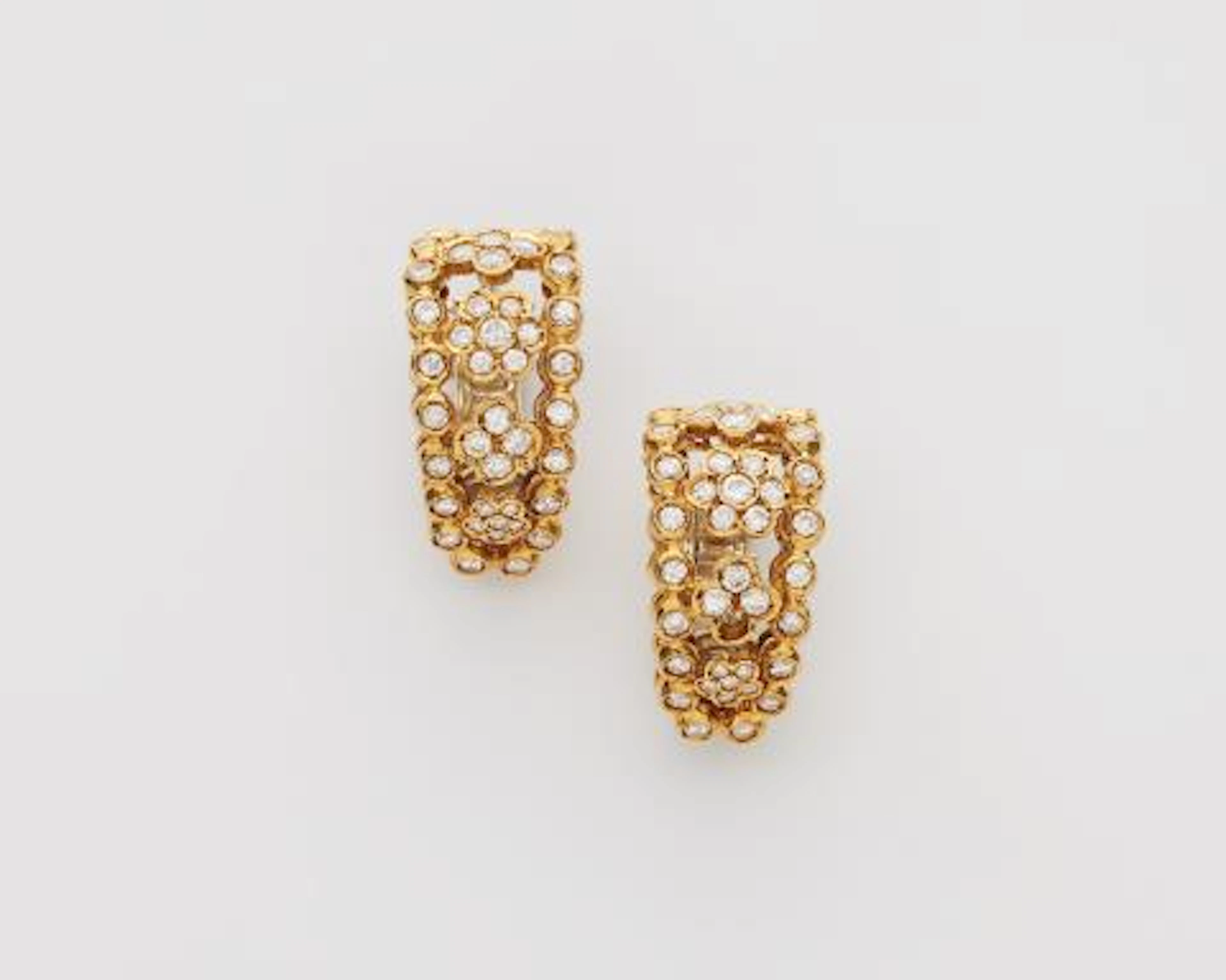 A pair of Italian 18k yellow gold and diamond creole clip earrings.