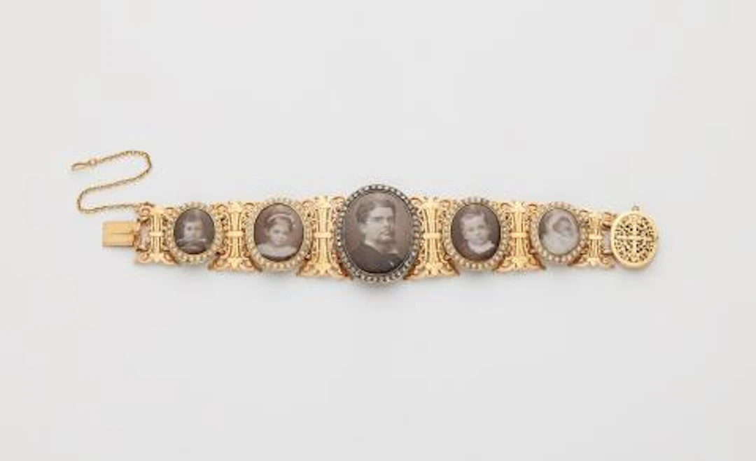 A late 19th century 18k gold pearl diamond mother of pearl and photo