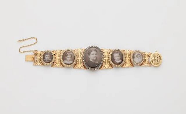 A late 19th century 18k gold pearl diamond mother of pearl and photo