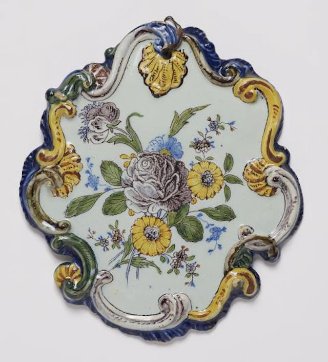 A Dutch Delft faience plaque with 'fleurs contournées'