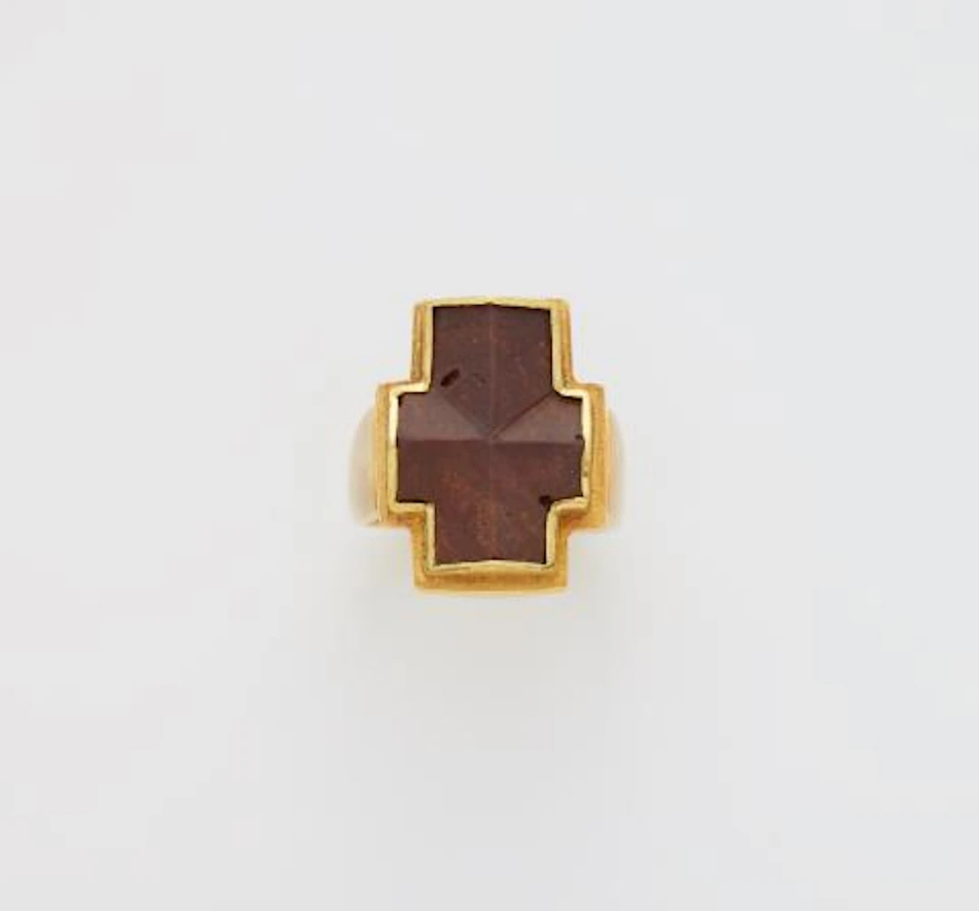 A German forged 14k gold and staurolithe Latin cross ring.