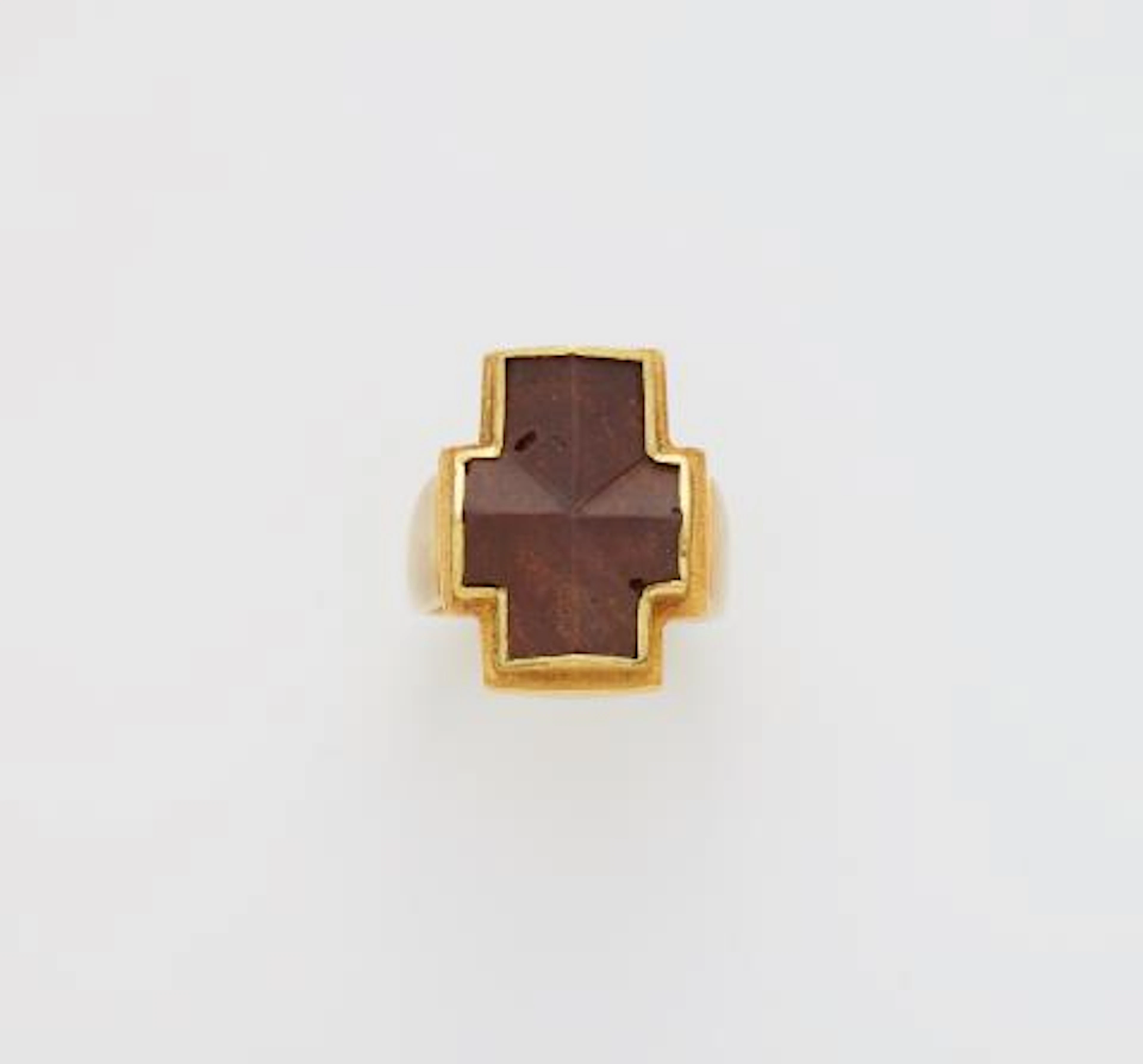 A German forged 14k gold and staurolithe Latin cross ring.