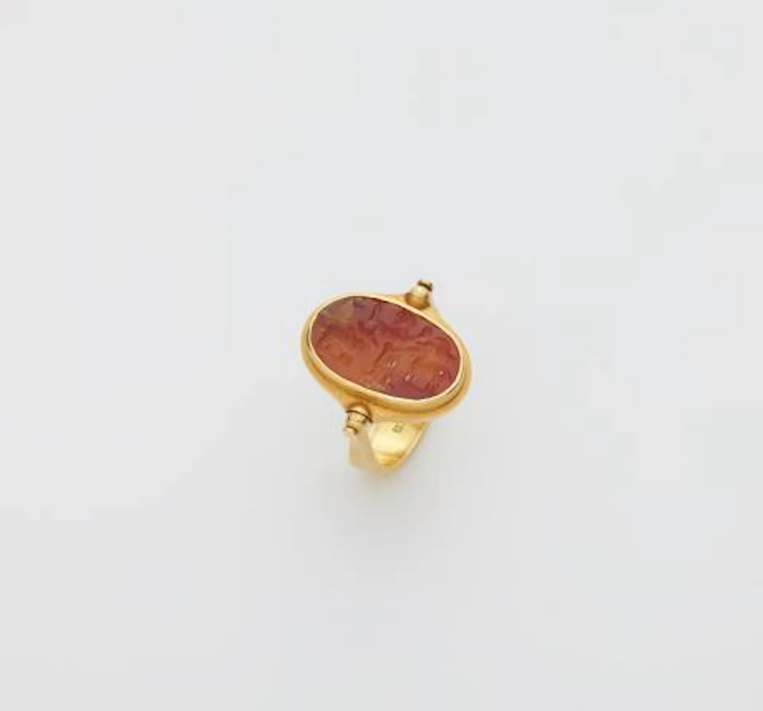 A German 18k gold swivel ring with a Sassanian carnelian intaglio