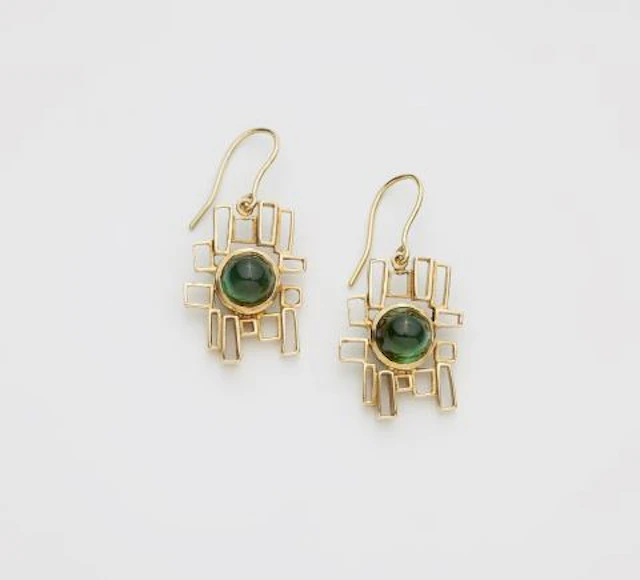 A pair of 14k gold and green tourmaline earrings.