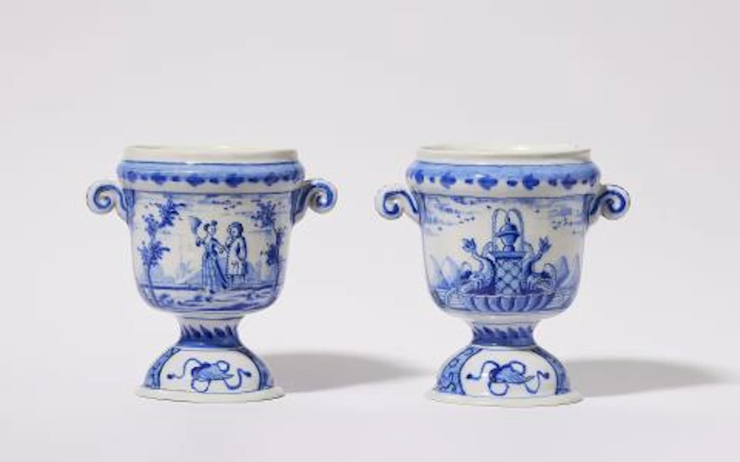 A rare pair of small Dutch Delft faience cachepots