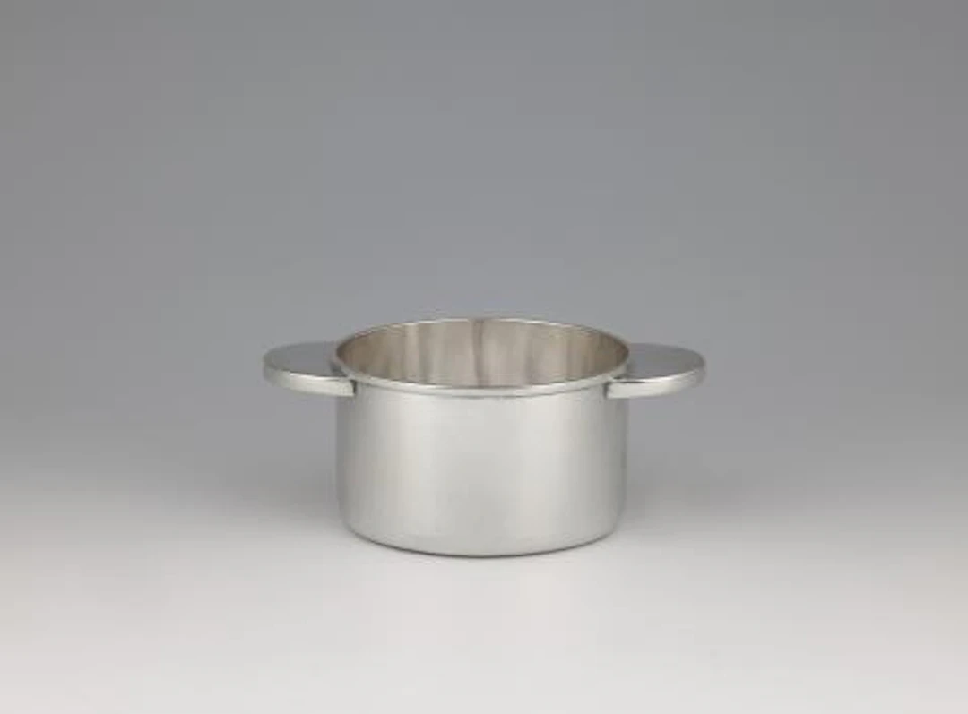 A rare silver bottle coaster by Emmy Roth