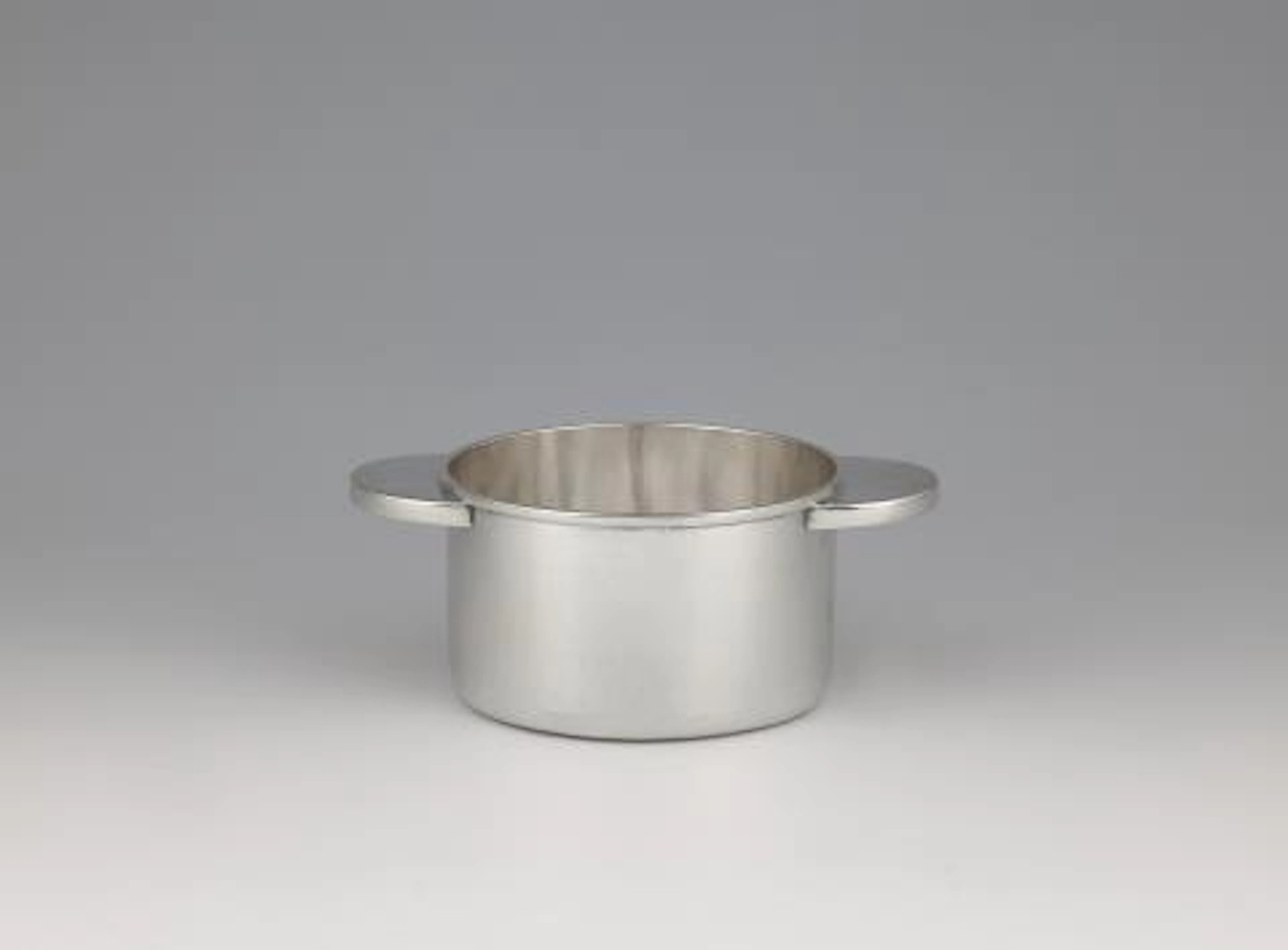 A rare silver bottle coaster by Emmy Roth