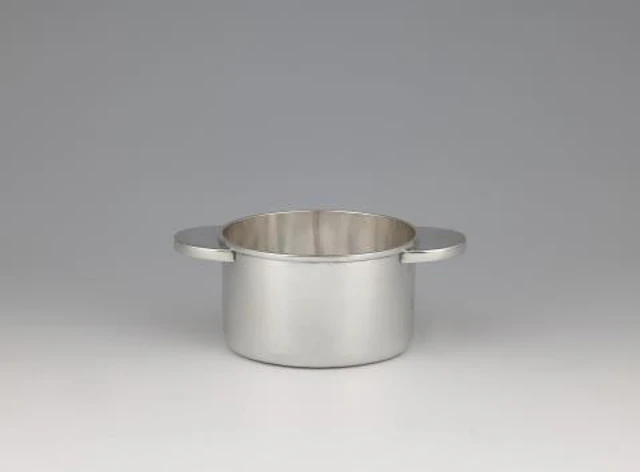 A rare silver bottle coaster by Emmy Roth