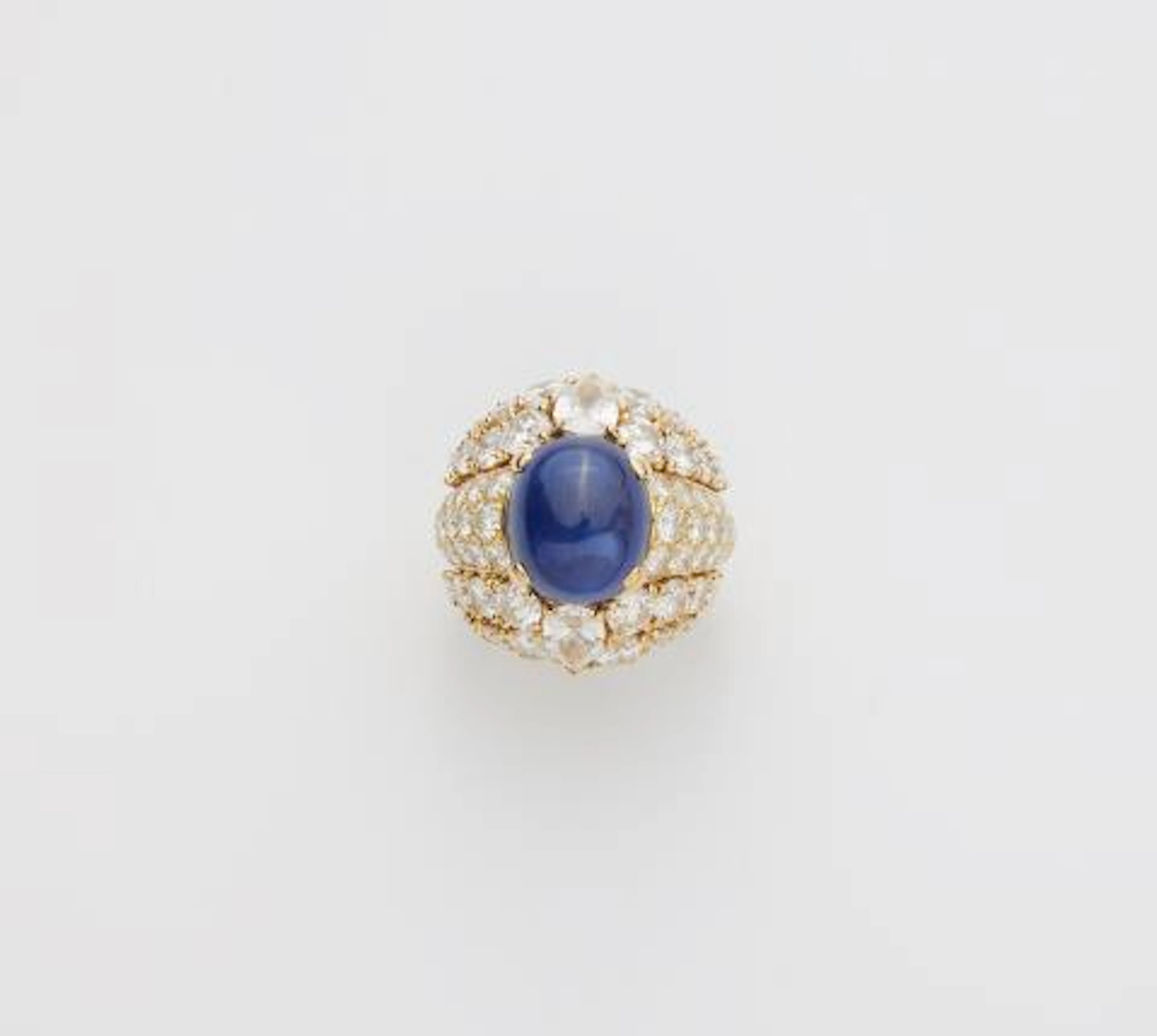 A French 18k yellow gold diamond and royal blue sapphire cabochon