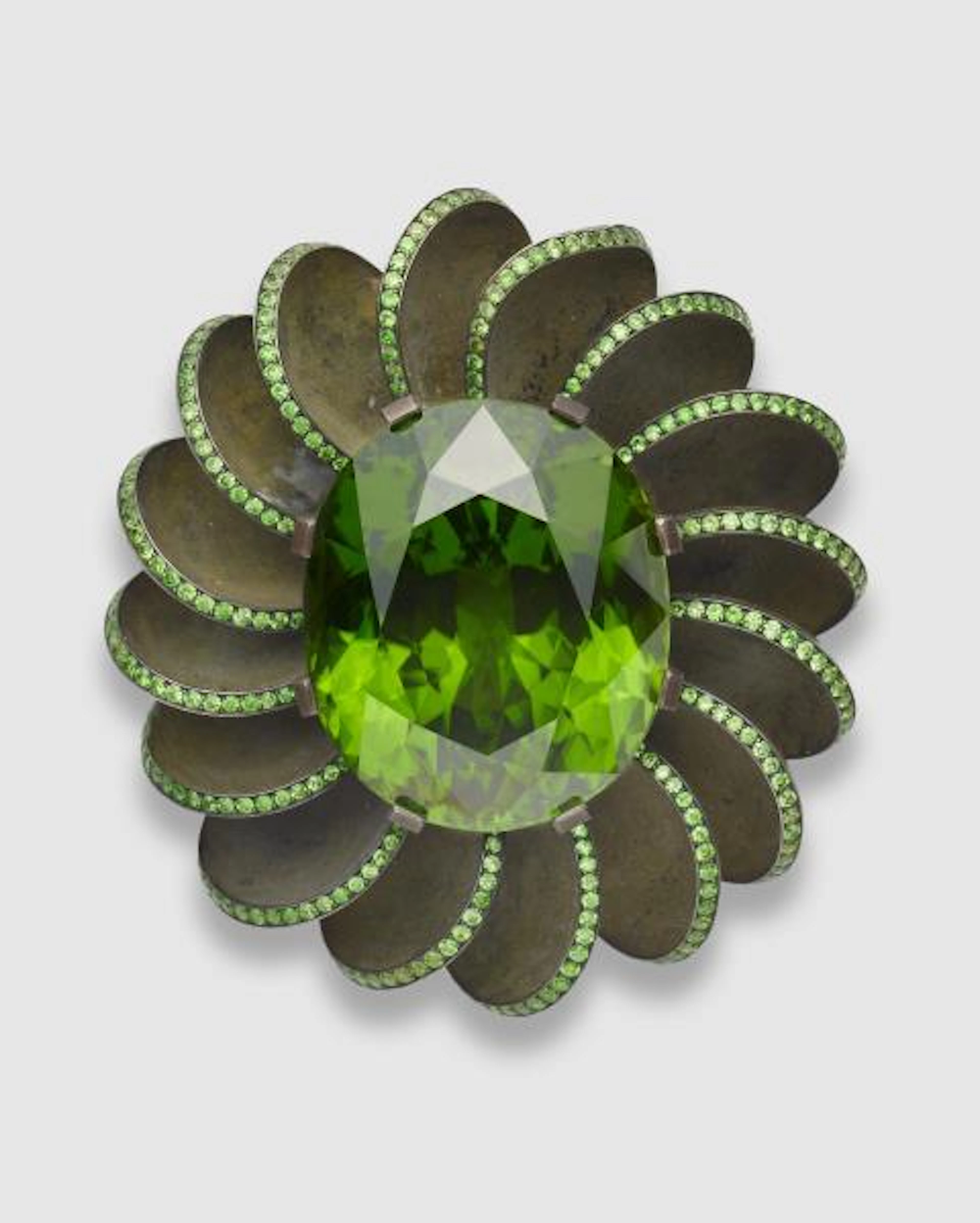 A green patinated silver blackened iron 18k gold and Russian demantoid