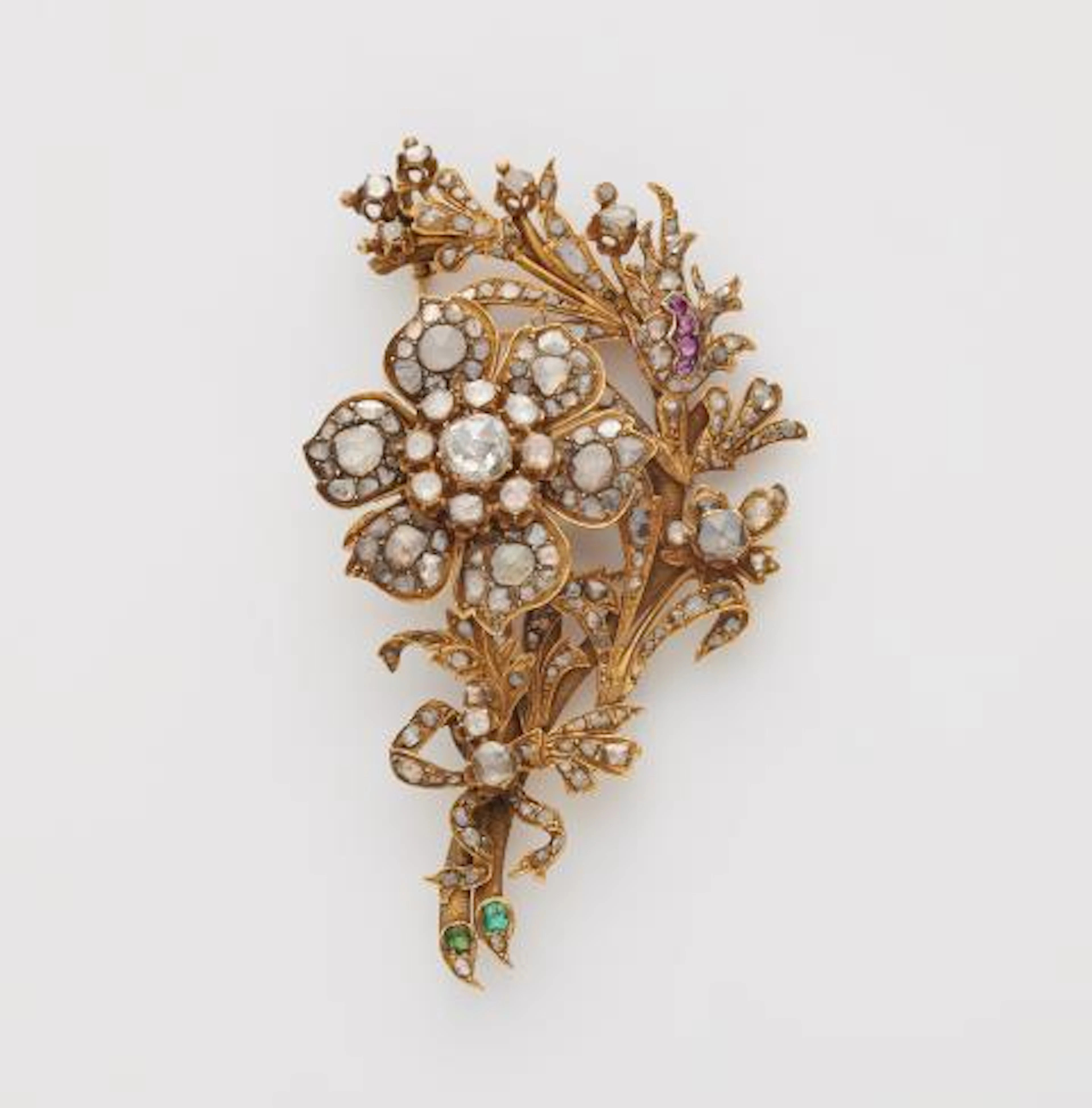 A 14k yellow gold coloured gemstone and foiled rose-cut diamond bouquet brooch.