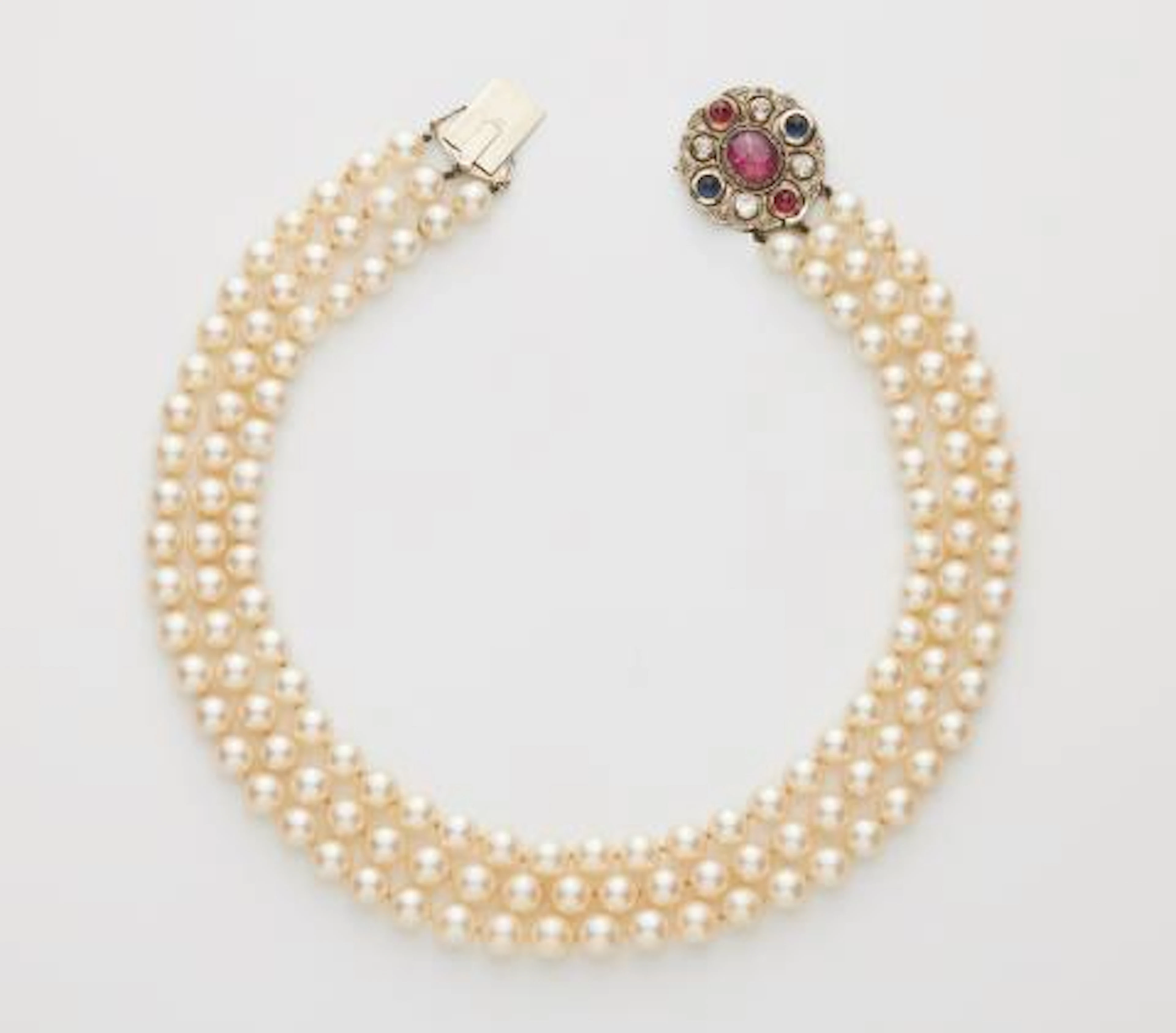A three-strand cultured pearl necklace with a diamond, Verneuil ruby