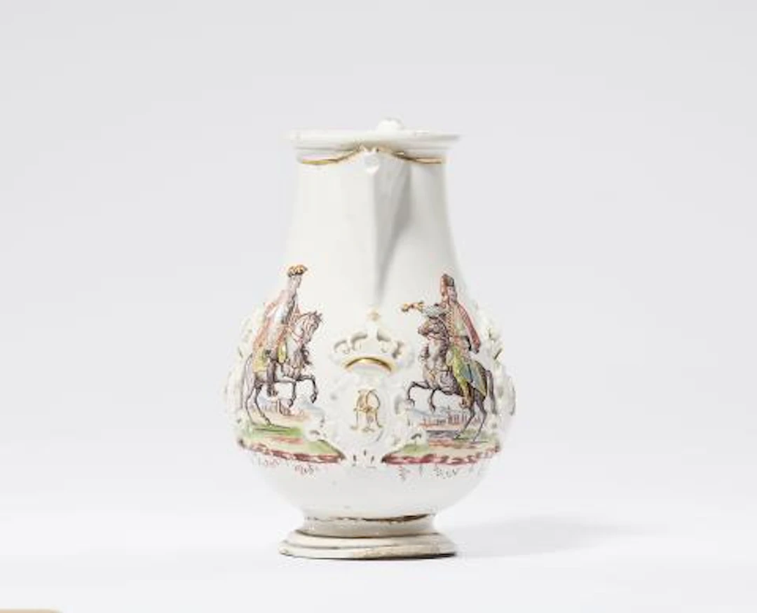 A porcelain coffee pot painted with a Hussar and a Saxon dragoon officer