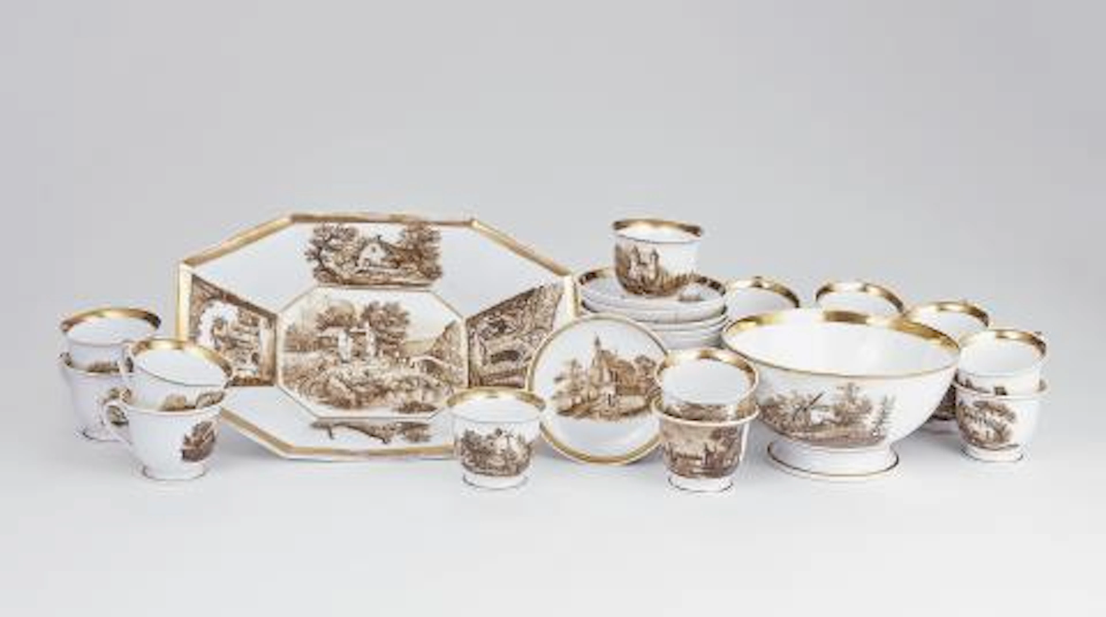 A porcelain anniversary service with Dutch landscapes