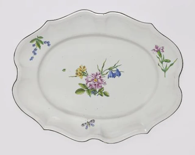 A Strasbourg faience plate with finely painted flowers