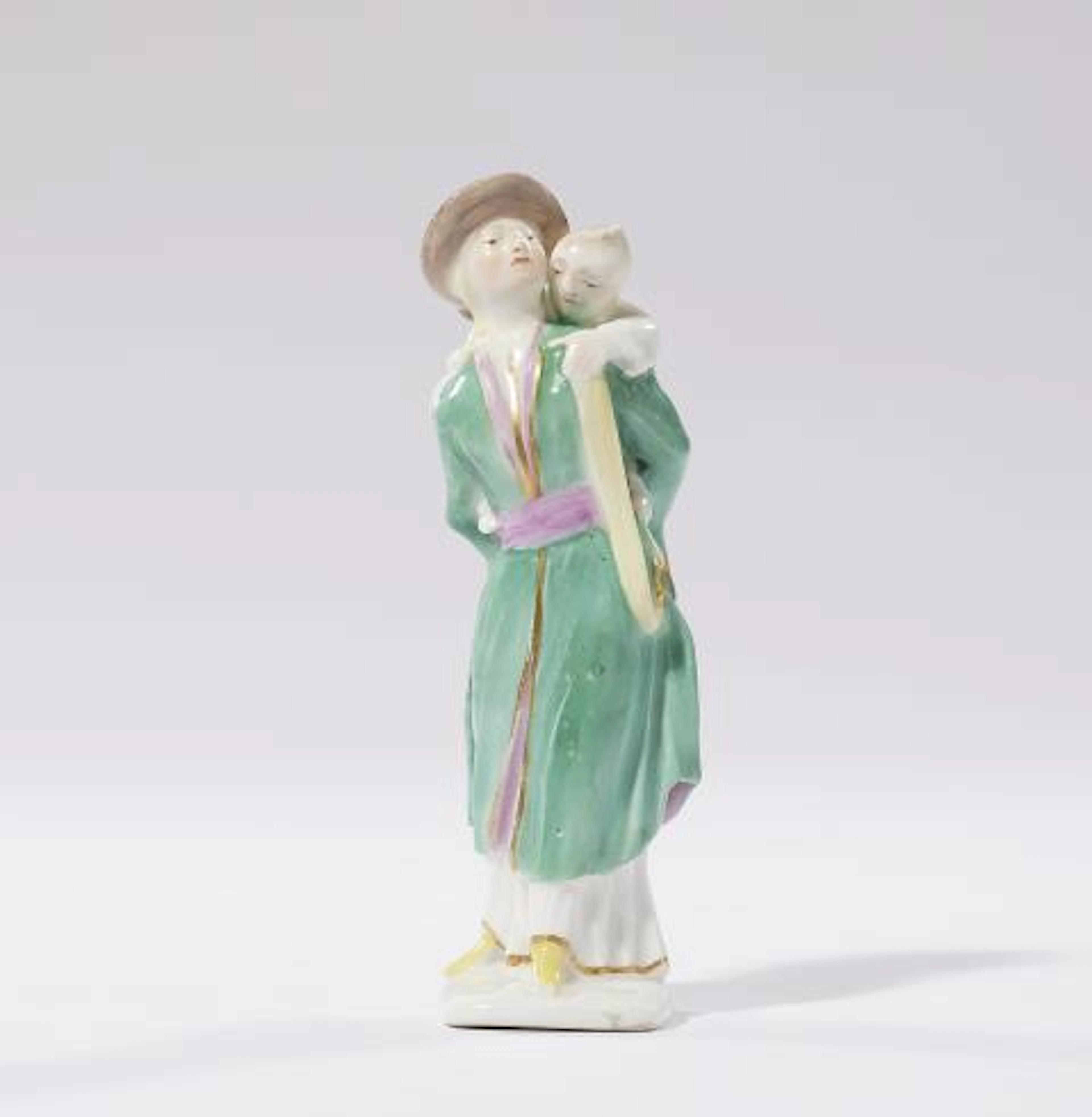 A rare Meissen porcelain figure of a Japanese woman carrying a child