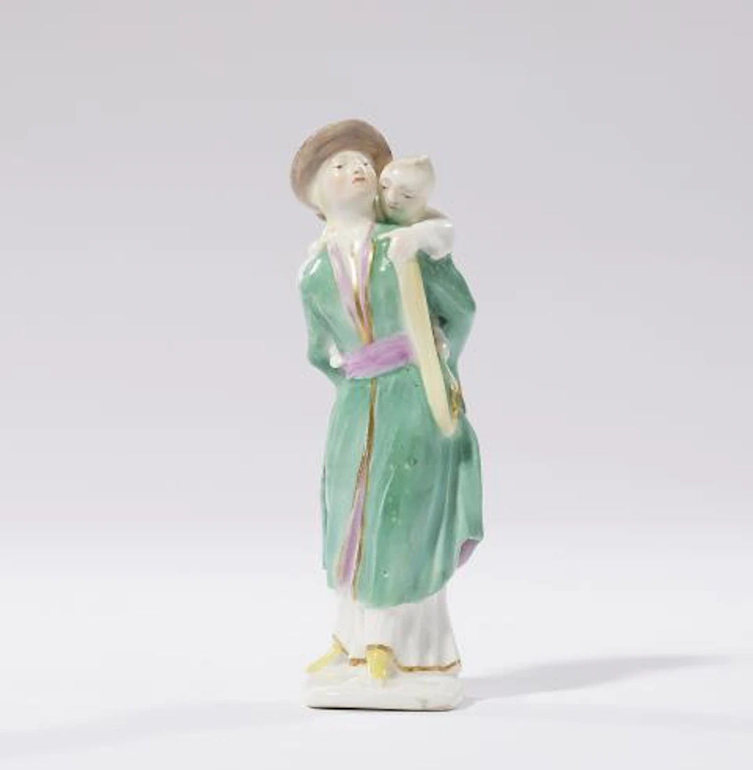 A rare Meissen porcelain figure of a Japanese woman carrying a child
