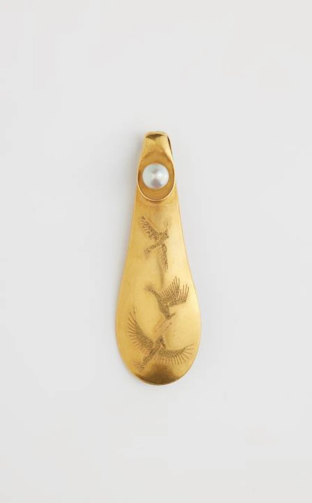A German 18k gold granulation brooch depicting hummingbirds in flight.