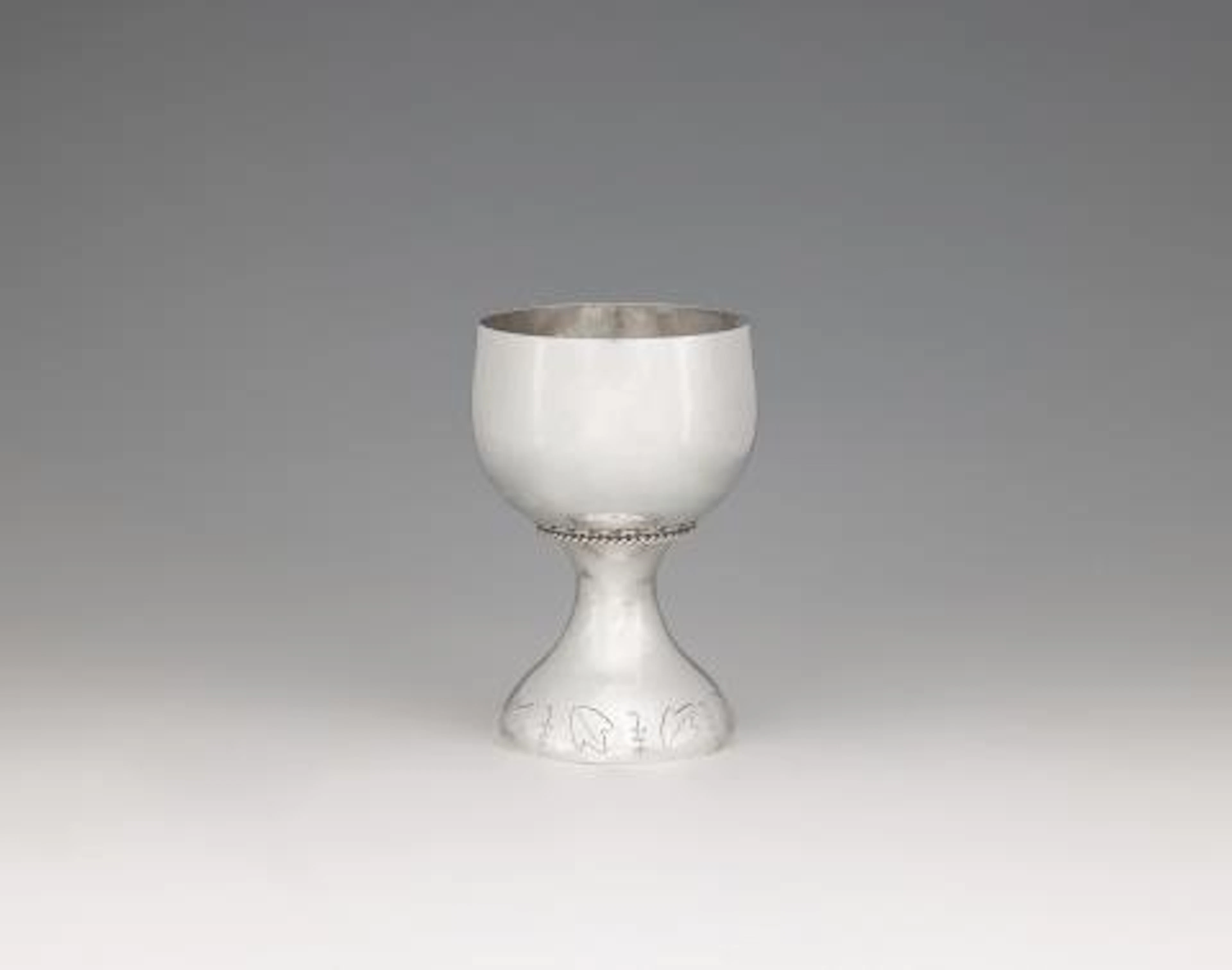 A small Art Deco silver wine goblet