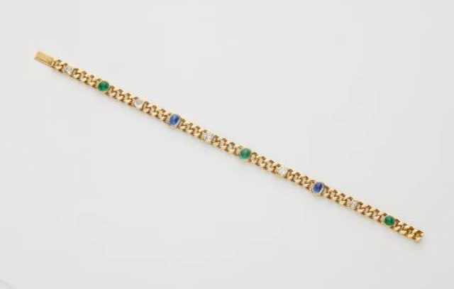 An Edwardian 18k gold, diamond and sugarloaf-cut emerald and sapphire