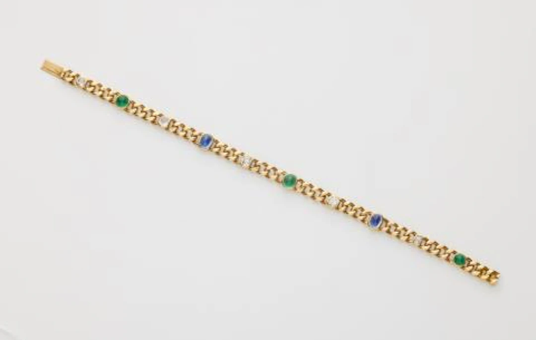 An Edwardian 18k gold, diamond and sugarloaf-cut emerald and sapphire