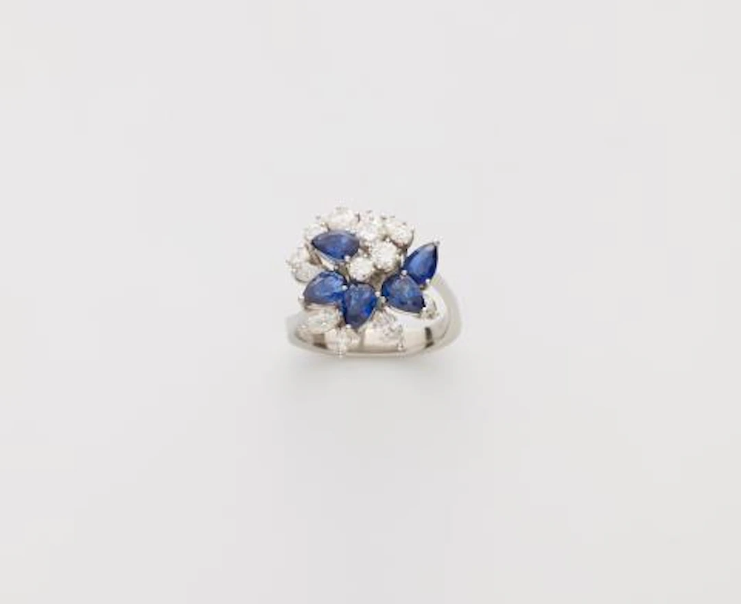 A platinum sapphire and diamond cocktail ring.