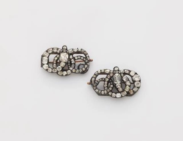A pair of silver and diamond George III snake miniature brooches with