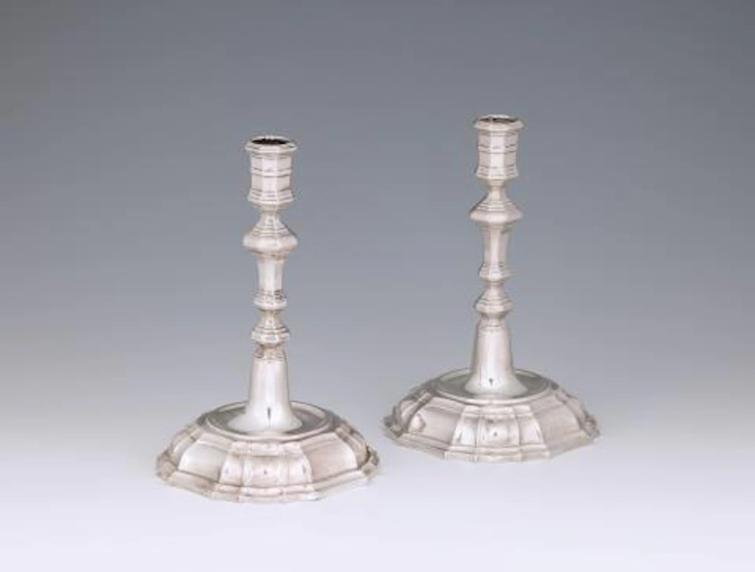 A pair of Cologne silver candlesticks