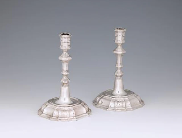 A pair of Cologne silver candlesticks
