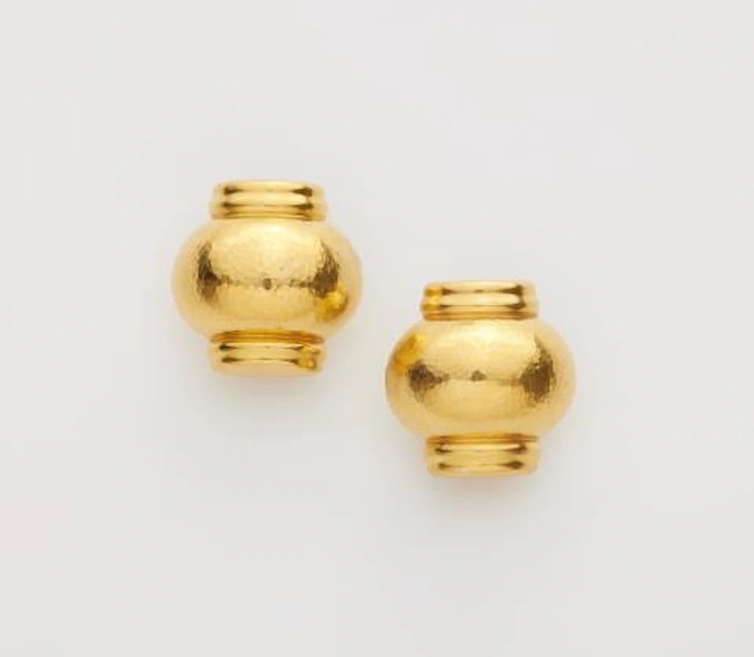 A pair of hammered 18k yellow gold clip earrings.