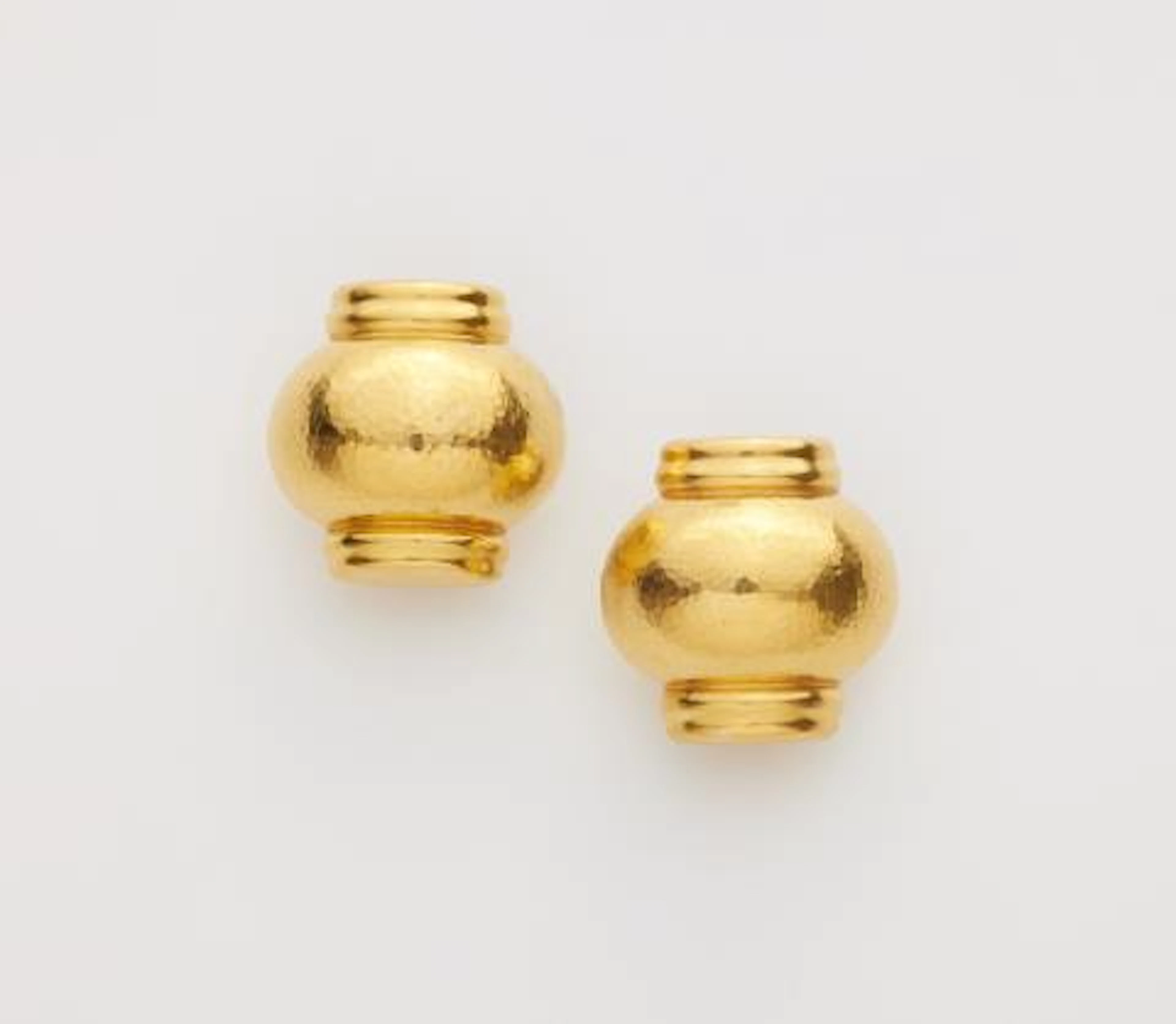 A pair of hammered 18k yellow gold clip earrings.