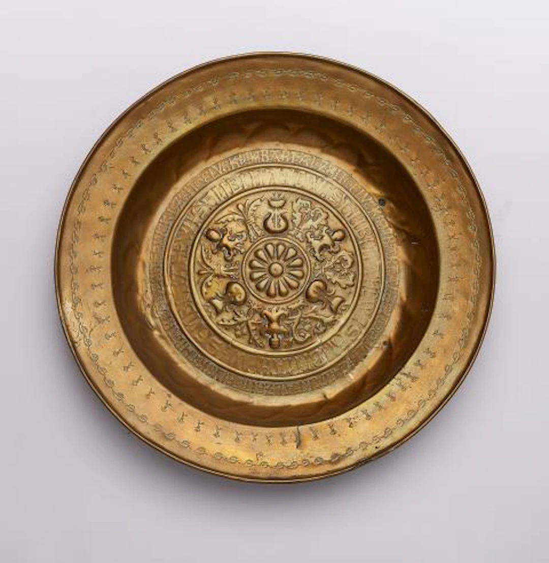 A brass 'Beckenschlägerschüssel' with concentric grotesques