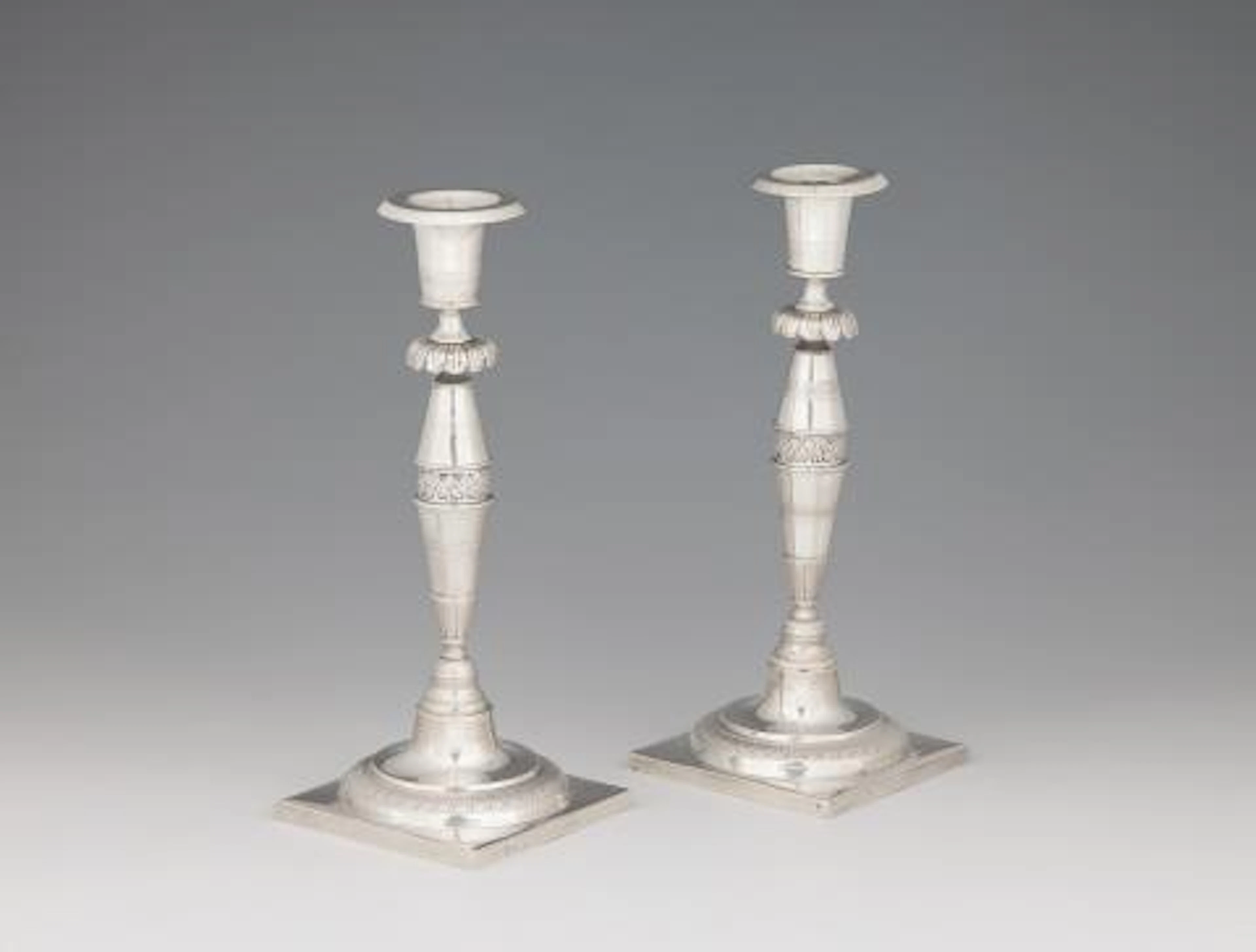 A pair of Berlin silver candlesticks