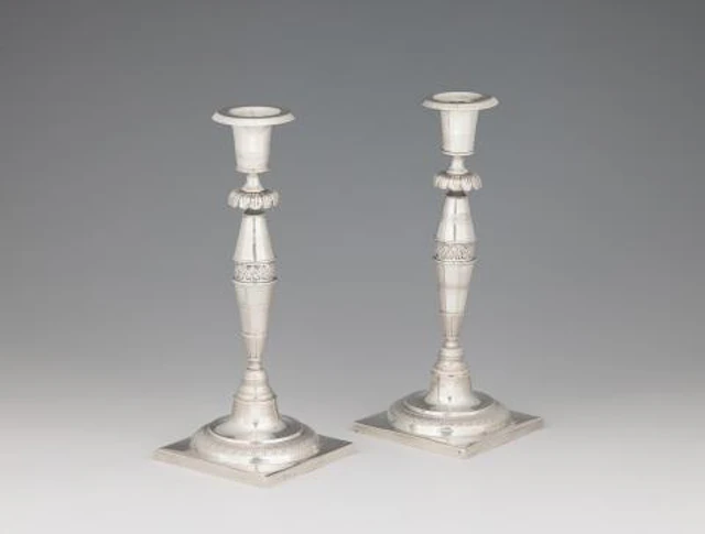 A pair of Berlin silver candlesticks